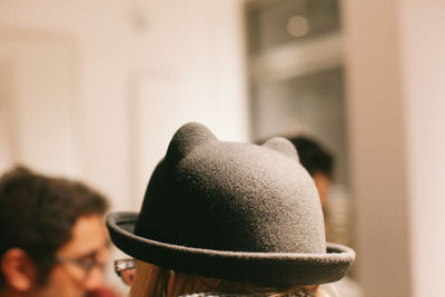 Close-up of woman wearing black hat
