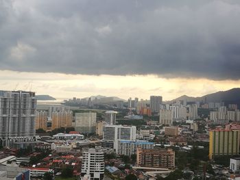 High angle view of buildings in city against sky