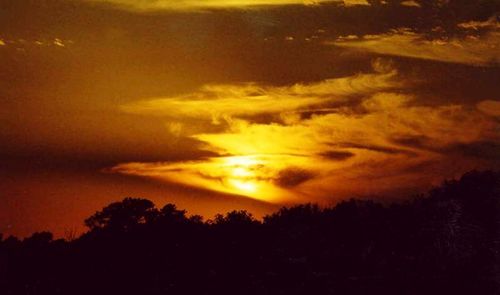 Low angle view of dramatic sky at sunset