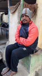 Portrait of man sitting in park