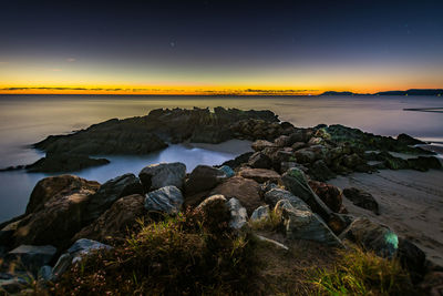 Scenic view of sea against sky at sunset