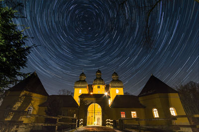 Low angle view of illuminated temple against sky at night