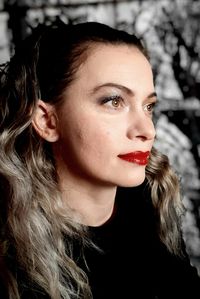 Close-up portrait of young woman looking away