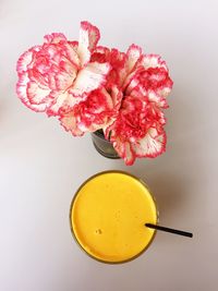 Close-up of yellow flowers against white background