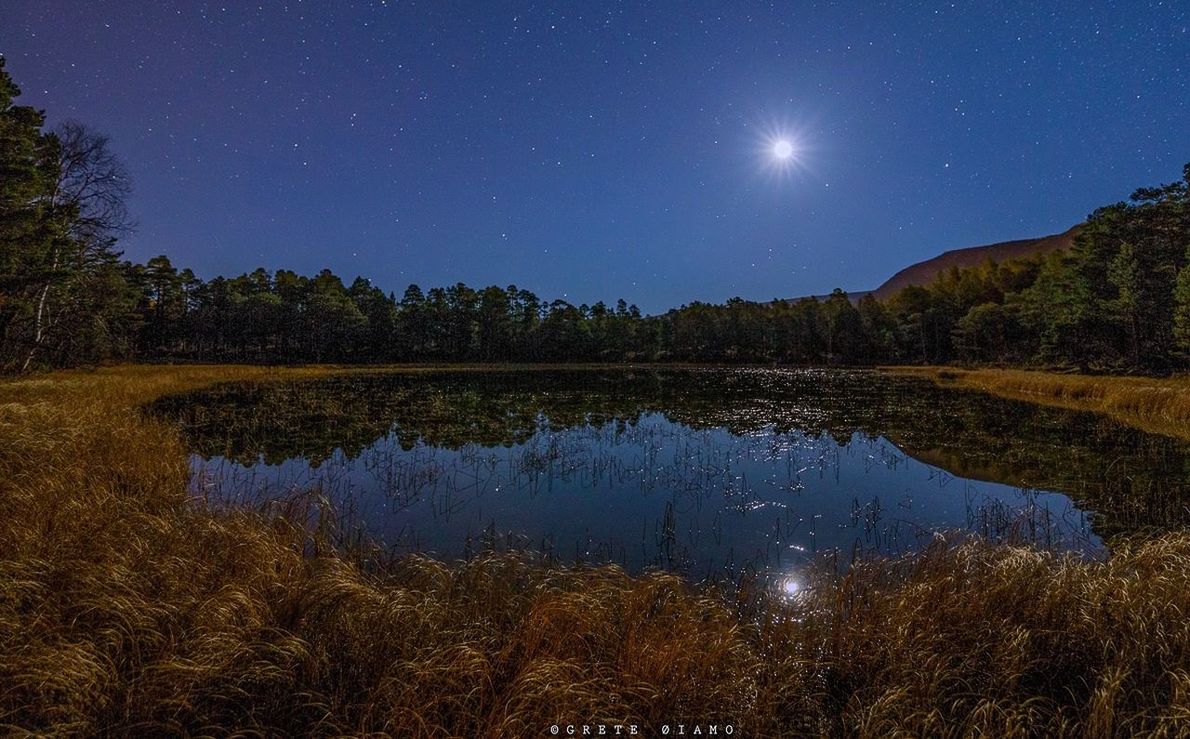 SCENIC VIEW OF LAKE AT NIGHT