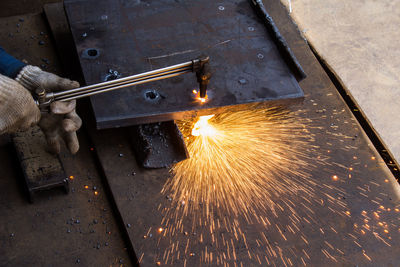 The technique of cutting holes in ferrous metal with a very hot laser flame