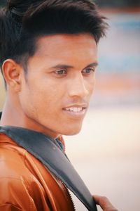 Portrait of young man looking away