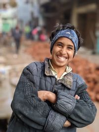 Portrait of a young boy standing outdoors ,poor boy ,child labour