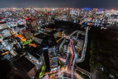 High angle view of illuminated city buildings