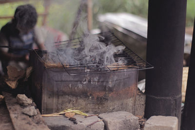 High angle view of people relaxing on barbecue grill