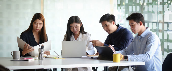 Business persons brainstorming at office