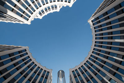 Low angle view of modern buildings against clear sky