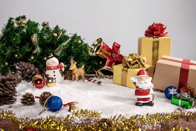 Close-up of christmas decorations against white background