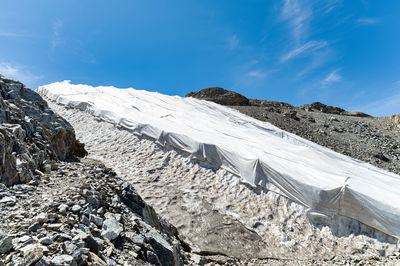 Protective drapes on glacier to protect from heat and melting snow on swiss alps