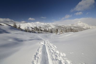 Snow covered mountain against sky