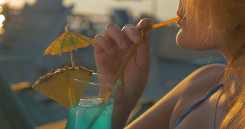 Close-up of woman holding drink