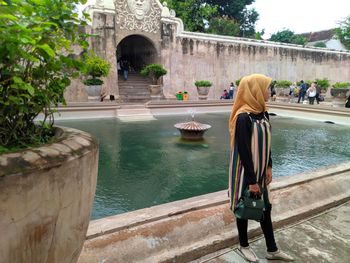 Rear view of men in fountain