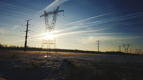 Electricity pylon on field