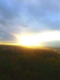 Scenic view of landscape against sky at sunset