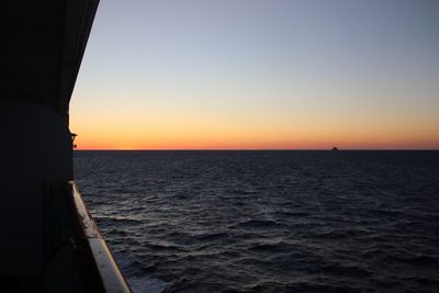 Scenic view of sea against clear sky during sunset