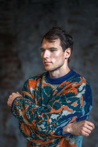 Portrait of young man standing outdoors