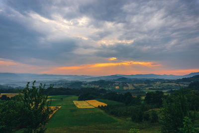 Scenic view of landscape against sky during sunset