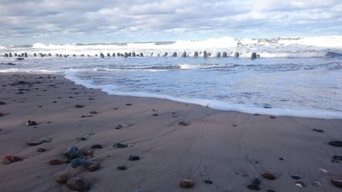 Scenic view of beach against sky