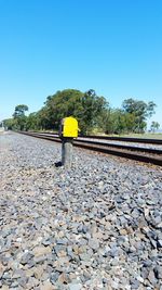 Low angle view of railroad tracks against clear sky