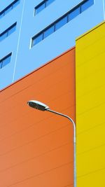 Street light in front of colorful building