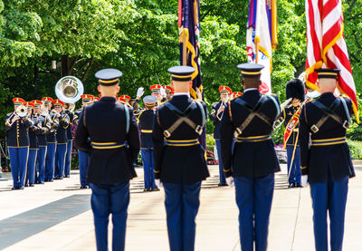 Rear view of soldiers standing in arlington national cemetery
