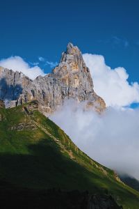 Scenic view of mountain against blue sky