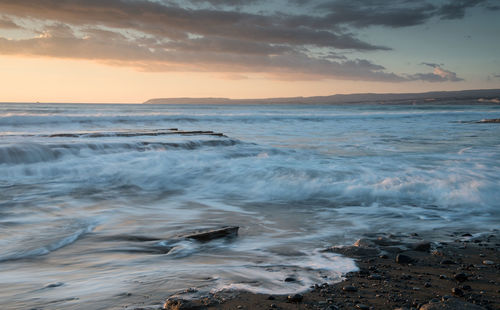 Scenic view of sea against sky during sunset