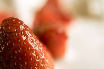 Close-up of strawberry over white background