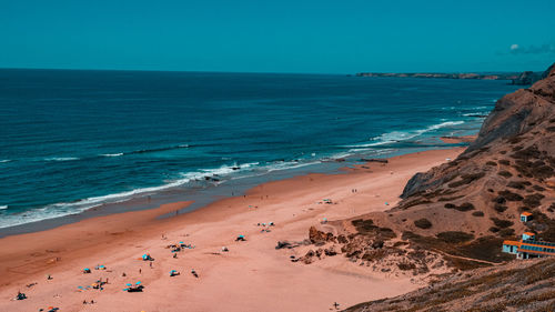 Scenic view of beach against clear sky