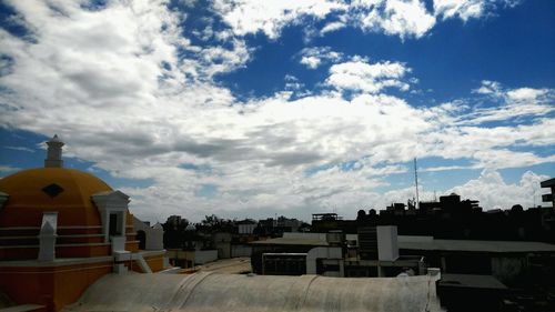 Town against cloudy sky