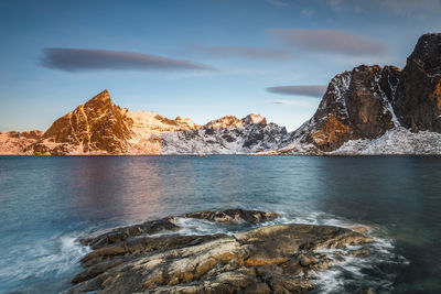 Scenic view of sea and rocks against sky