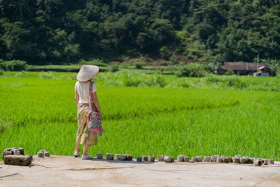 Rear view of person on field