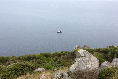 High angle view of rocks in sea