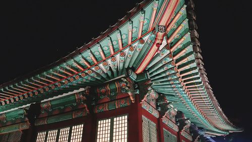 Low angle view of temple against clear sky at night