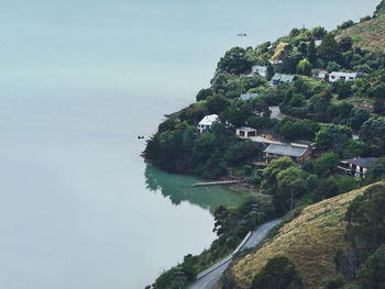 Scenic view of sea and mountains against sky