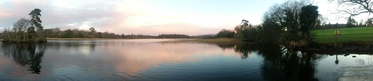 Panoramic view of lake against sky during sunset