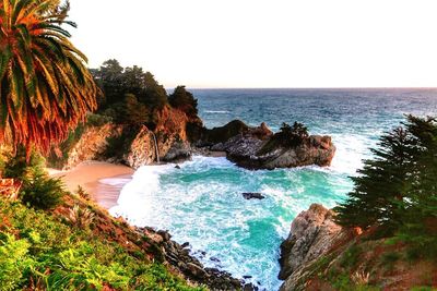 Scenic view of beach against clear sky