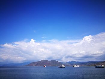 Scenic view of sea against blue sky