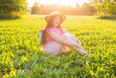 Portrait of smiling woman on field