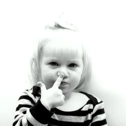 Portrait of cute girl holding white background