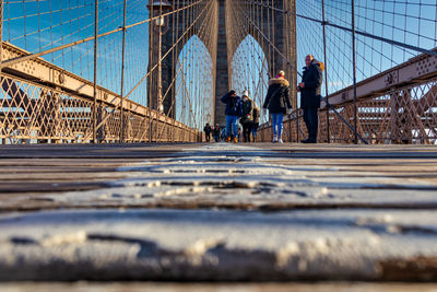 People walking on bridge