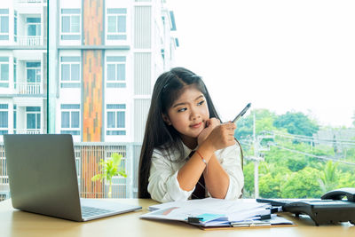 Girl working at desk in office