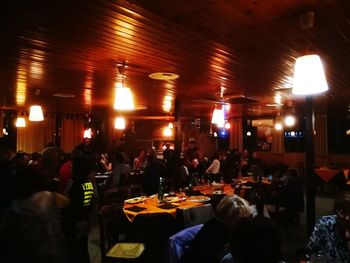 Group of people in restaurant at night