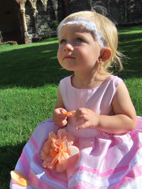 Close-up of a girl holding plant