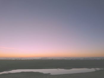 Scenic view of sea against sky at sunset